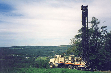 A well-drilling truck on top of a mountain